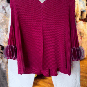 Women’s Textured Red Long-Sleeve Top with V-Neck Collar & Pleated Sleeve Detail – Paired with White Slim Pants