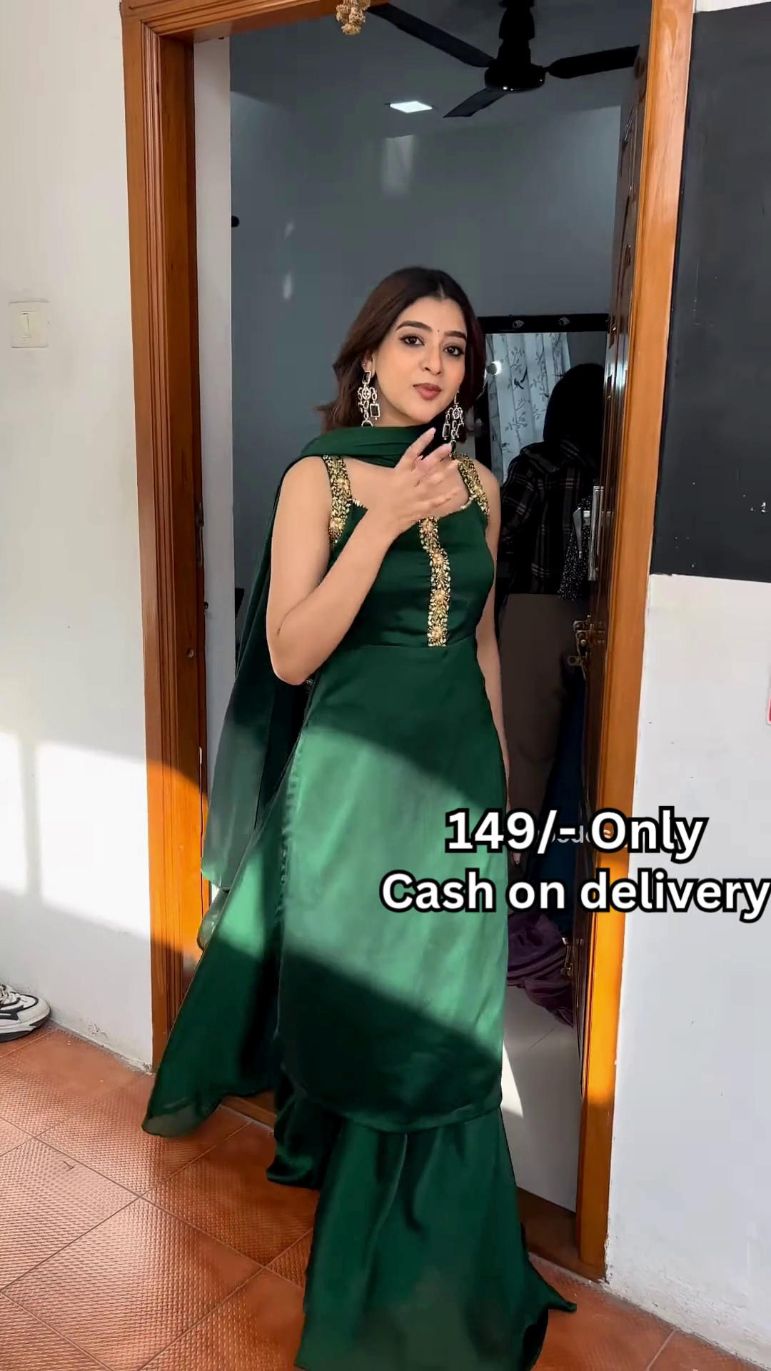 Women’s Red Embroidered Skirt Top Set with Traditional Earrings – Ethnic Doorway Portrait Ensemble - Image 3