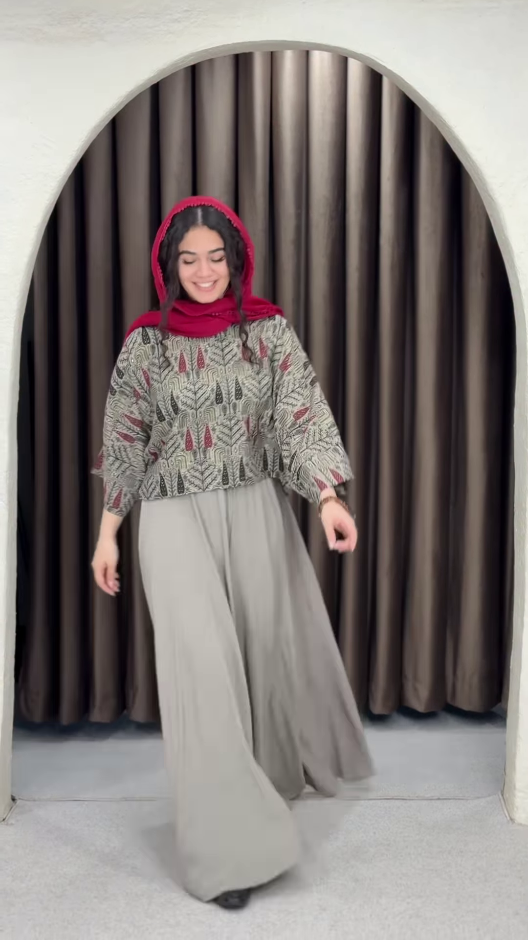 Women’s Red Printed Headscarf with Abstract Top & Gray Wide-Leg Pants – Boho Urban Doorway Portrait Ensemble - Image 2