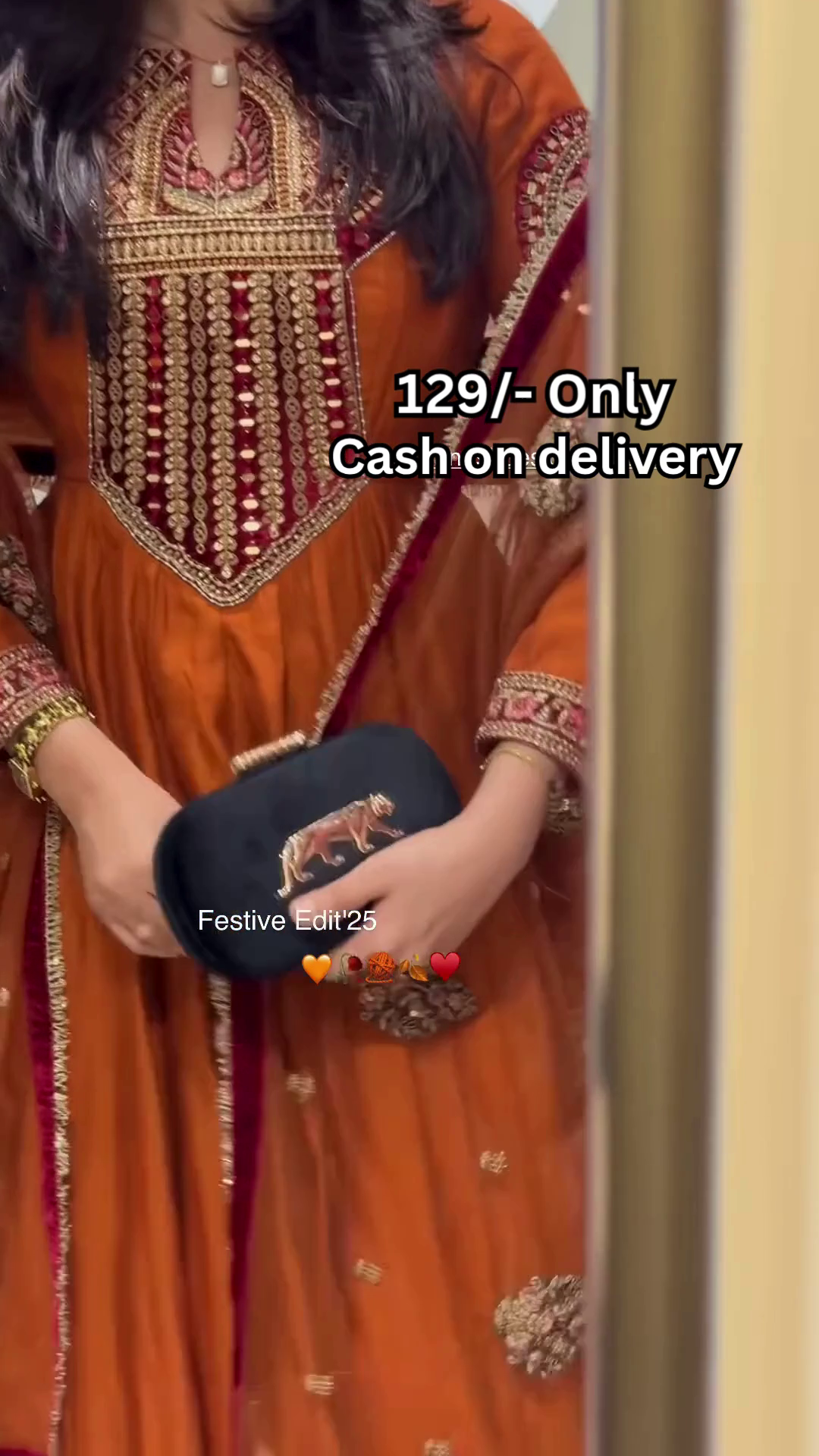 Women’s Orange Embroidered Kurti with Gold & Red Threadwork – Festive Ethnicwear Styled with Black Clutch Accessory - Image 3