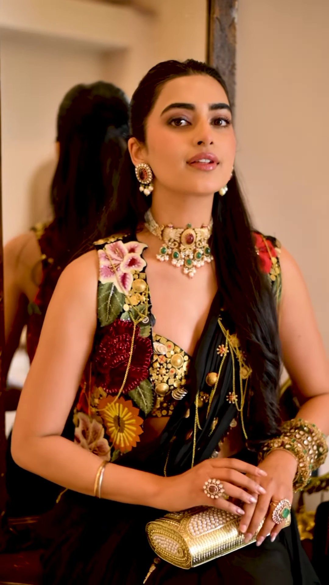 Women’s Black Saree with Gold Embellishments & Pleated Draping – Elegant Ethnicwear Styled with Traditional Bracelet - Image 2