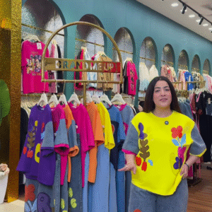 Multicolor Printed Ethnicwear Rack Display – Bold Floral & Abstract Garments in Boutique Interior with Teal-Gold Accents