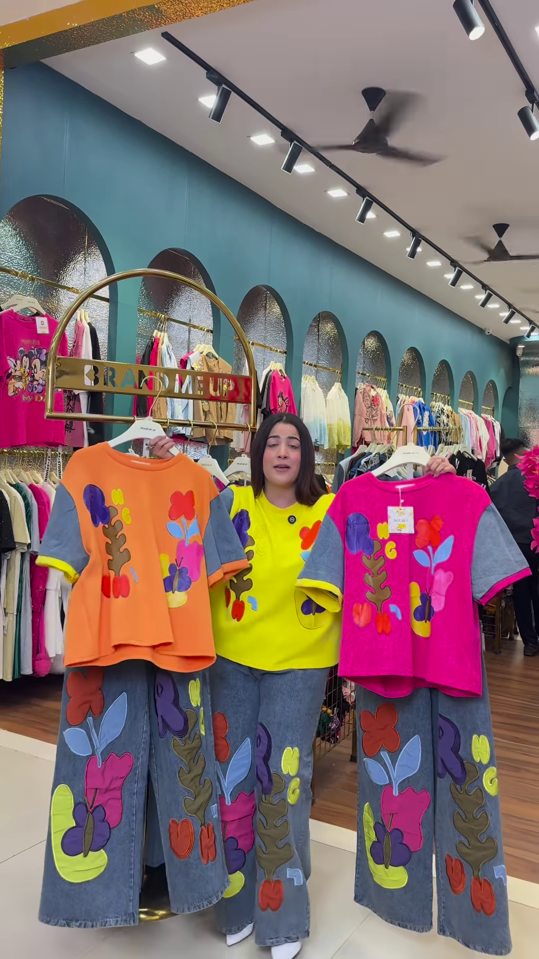 Multicolor Printed Ethnicwear Rack Display – Bold Floral & Abstract Garments in Boutique Interior with Teal-Gold Accents - Image 4